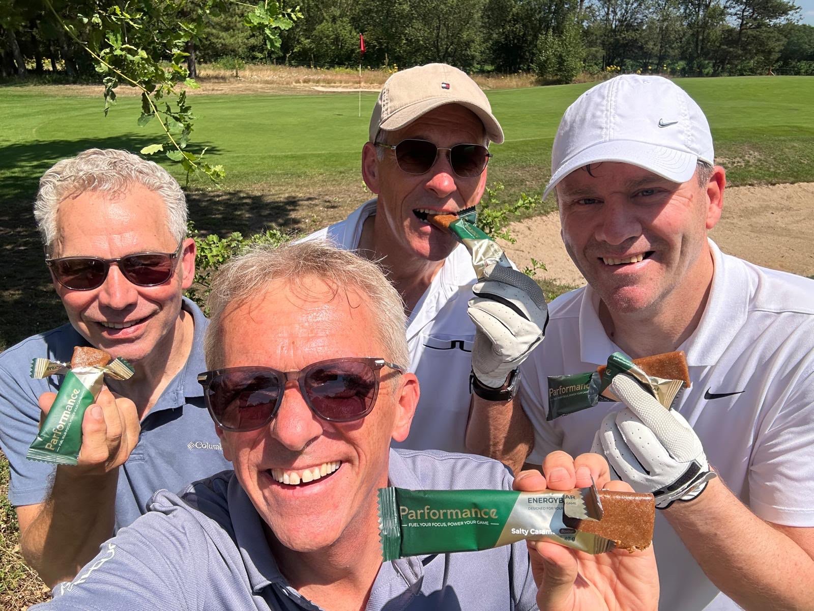 Four golfers with Parformance bars on the course