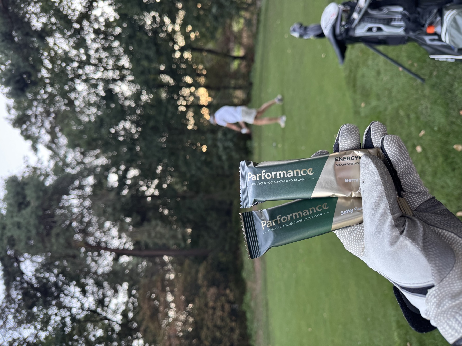 A golfer with a Parformance bar on the course